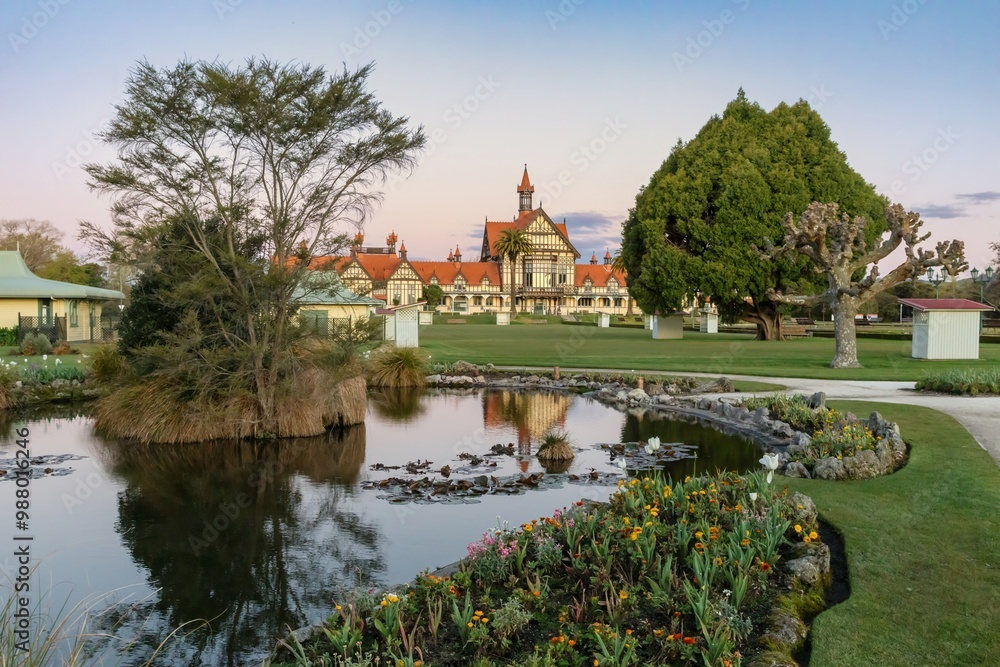 Fototapeta premium The Rotorua Museum, pond and park of the Government Gardens, Rotorua, Bay of Plenty, New Zealand.