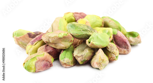 Tasty peeled pistachio nuts isolated on white
