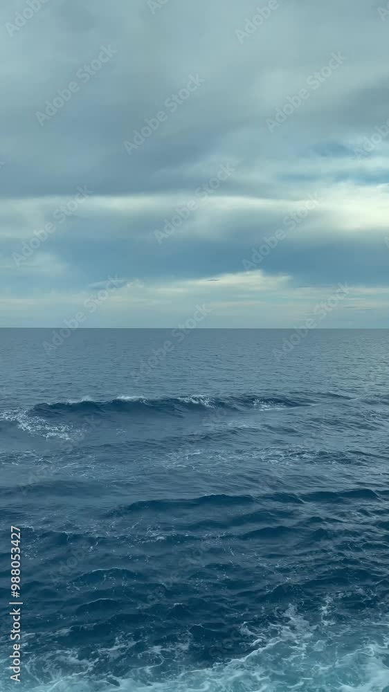 Tranquil Ocean Surface Under Cloudy Sky 4K Video with Gentle Waves and Expansive Horizon, Capturing Calm Natural Seascape and Serene Weather Atmosphere Tranquil Ocean Surface Under Cloudy Sky 4K Video with Gentle Waves and Expansive Horizon, Capturing Calm Natural Seascape and Serene Weather Atmosphere