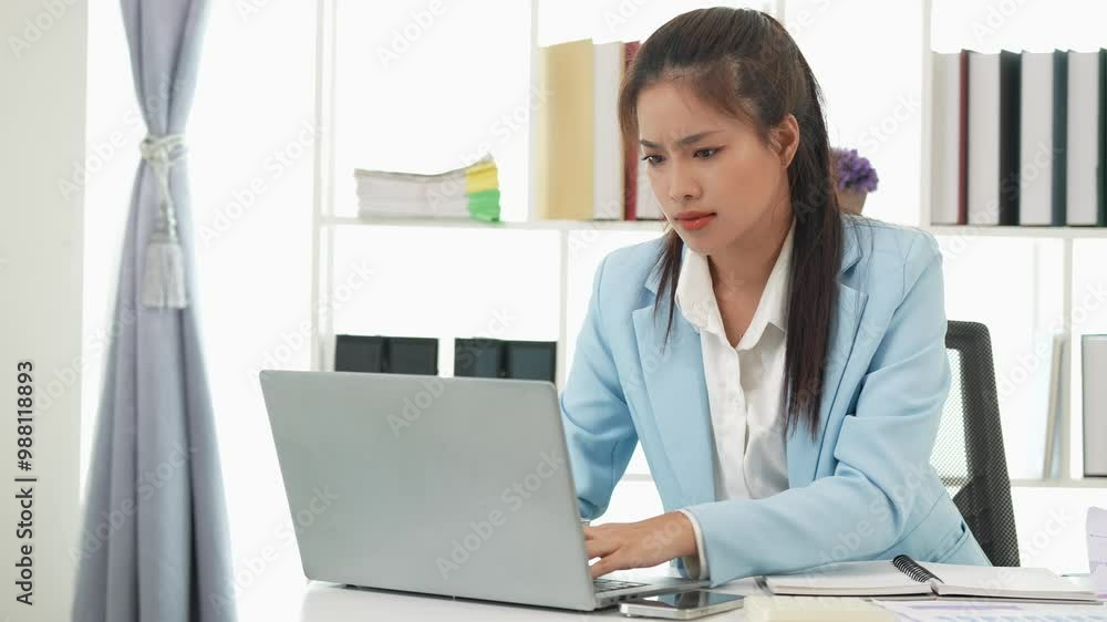 Asian businesswoman doing tax, accounting, statistics and analysis research using laptop computer and working in office with calculator on desk with documents, planning, analyzing financial report. Asian businesswoman doing tax, accounting, statistics and analysis research using laptop computer and working in office with calculator on desk with documents, planning, analyzing financial report.