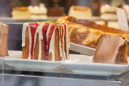 Temptingly Delicious Cakes Beautifully Displayed in an Inviting Bakery Shop Window photo