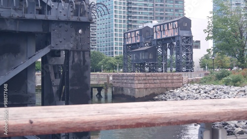 New York City Gantry Plaza dock pier, Long Island sign, Hunters Point, Queens, United States. Industrial waterfront iron vintage landmark, historic old riverfront gantry, East River opposite Manhattan