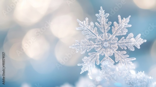 Silver snowflake charm transforming into flurry of real snowflakes.