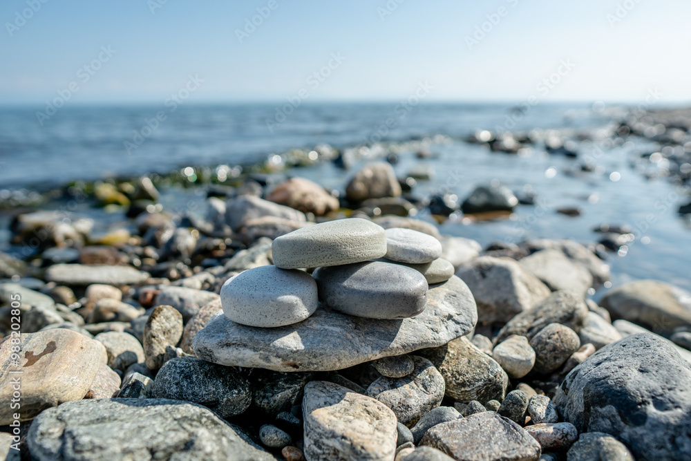 Handmade craft soap in the shape of stones on the seashore or lake. The image of organic cosmetics in the natural environment