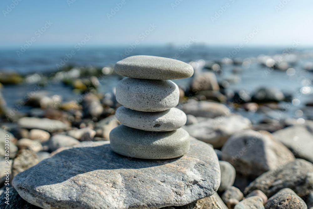 Fototapeta premium Handmade craft soap in the shape of stones on the seashore or lake. The image of organic cosmetics in the natural environment