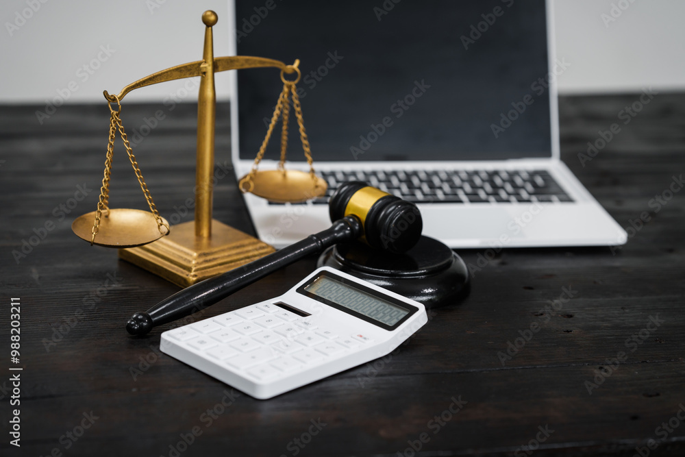 A lawyer's desk in an office,with legal documents, computers, and hammers placed neatly.The setting is organized for legal consulting services, contract reviews,will drafting,document certification A lawyer's desk in an office,with legal documents, computers, and hammers placed neatly.The setting is organized for legal consulting services, contract reviews,will drafting,document certification