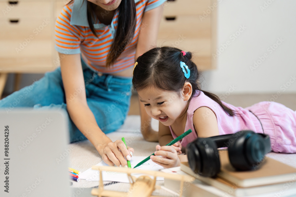 Mother and Daughter Enjoying Quality Time Drawing Together at Home Mother and Daughter Enjoying Quality Time Drawing Together at Home