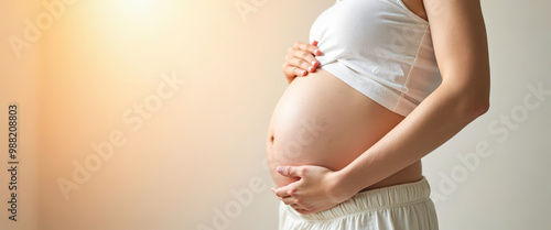 Pregnant Woman Holding Her Baby Bump photo