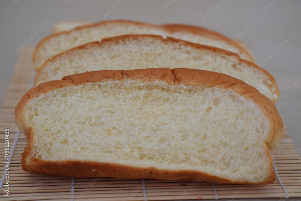 Sliced bread on a bamboo mat Sliced bread on a bamboo mat