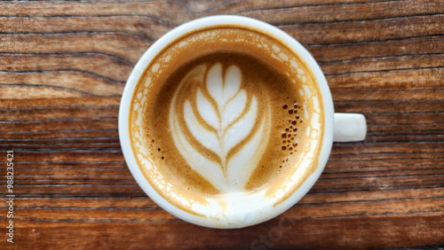 Top view latte art coffee on wood background