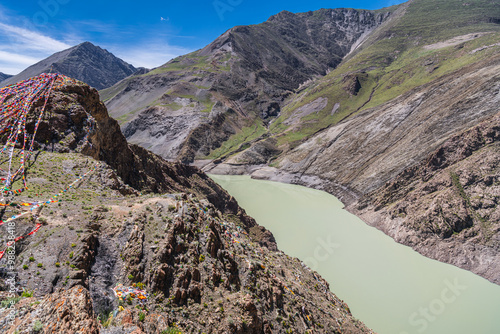 The turquoise colored Manla reservoir on the Nyang river seen from the 4200 m photo