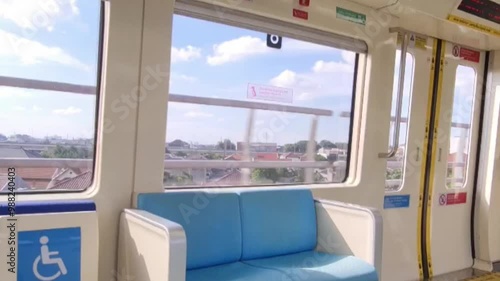 Jakarta, Indonesia on December 7, 2023. Interior of an Indonesian state-owned LRT Light Rail Transit train operating in DKI Jakarta. The Jakarta LRT has a 5.8 km long track serving six stations. photo