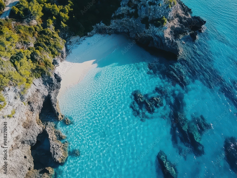 Aerial View of a Secluded Cove with a Sandy Beach and Clear Turquoise Water Aerial View of a Secluded Cove with a Sandy Beach and Clear Turquoise Water