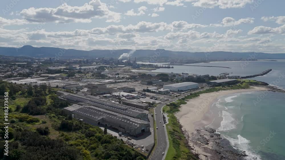 Aerial trucking pan over highway along coast in industrial zone of Port Kembla NSW Australia Aerial trucking pan over highway along coast in industrial zone of Port Kembla NSW Australia