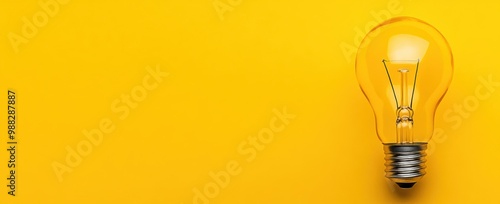 Light Bulb on Yellow Background   Idea  Innovation  Inspiration  Creativity  Solution  Suc photo