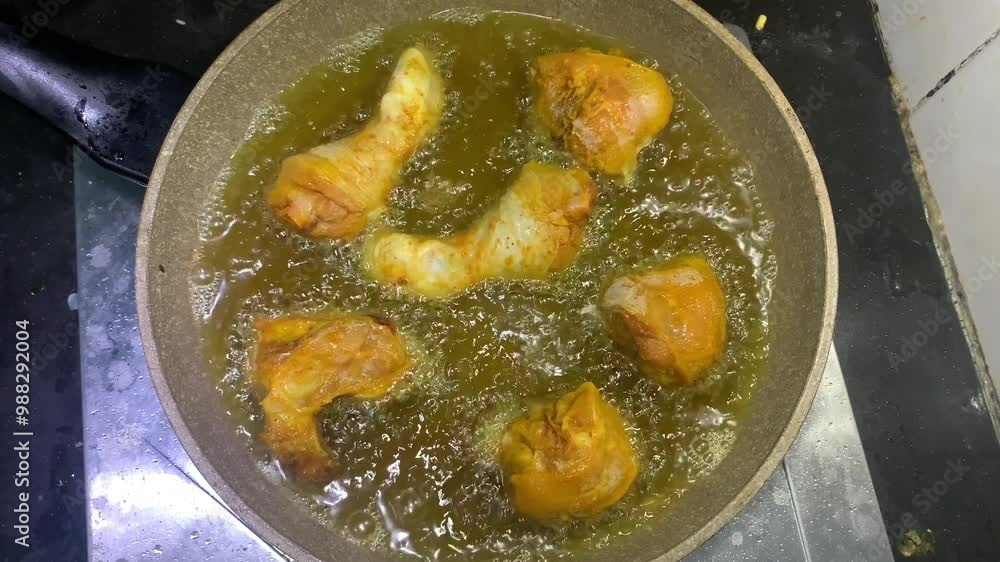 View of fried chicken being cooked in a pan, this dish is very tasty when served with hot rice. View of fried chicken being cooked in a pan, this dish is very tasty when served with hot rice.