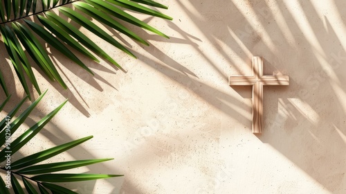 Wooden cross and palm leaves on neutral background