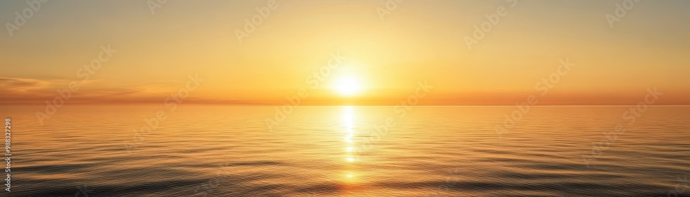 Obraz premium Stunning Golden Sunset Over Calm Ocean Waters with Clear Sky and Gentle Waves