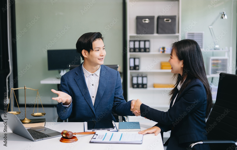 Judge and client shaking hands and lawyers discussing contract papers after adviced in background at courtroom, lawyer service. Judge and client shaking hands and lawyers discussing contract papers after adviced in background at courtroom, lawyer service.