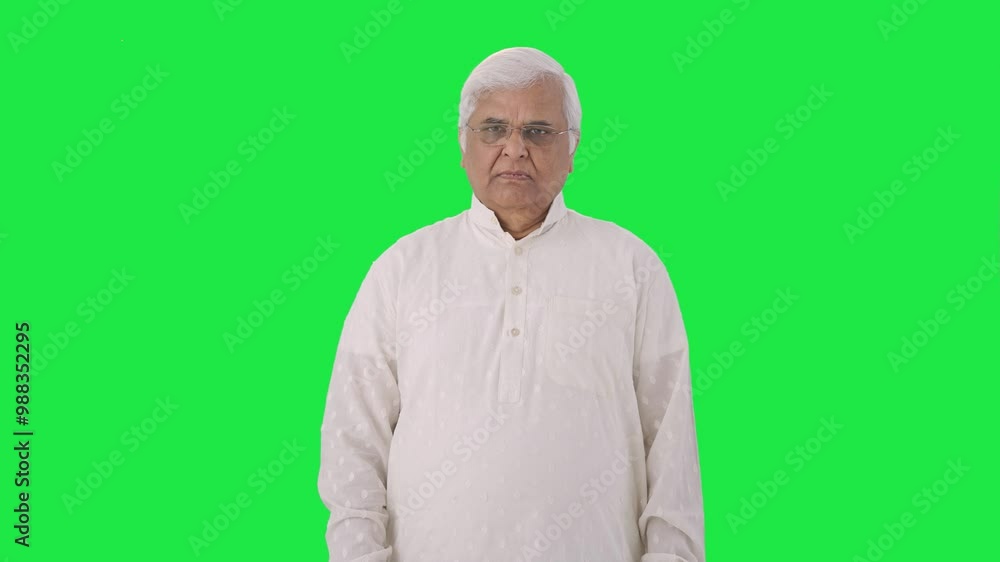 Indian old man looking at the camera Green screen Indian old man looking at the camera Green screen