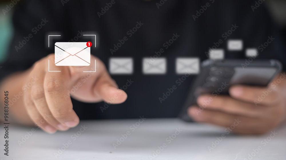 A person is pointing at a cell phone screen with a message that says A person is pointing at a cell phone screen with a message that says