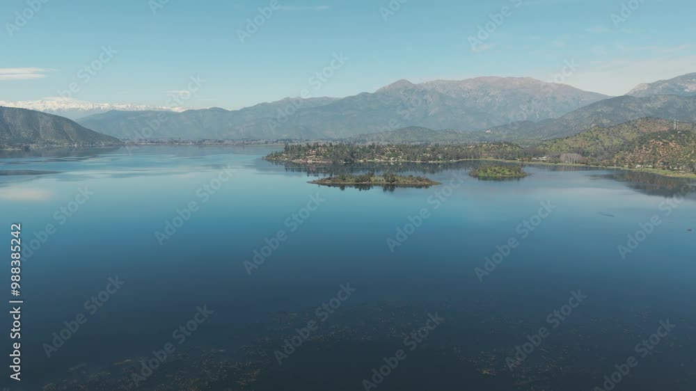Aerial view of aculeo lagoon reflecting the Andean mountains on a sunny and clear day Aerial view of aculeo lagoon reflecting the Andean mountains on a sunny and clear day