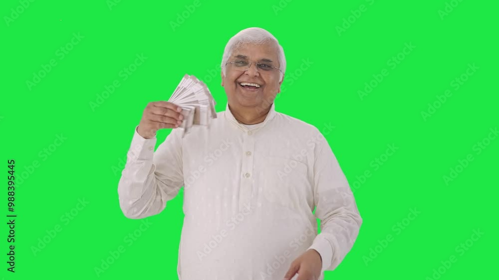 Happy Indian old man using money as fan Green screen Happy Indian old man using money as fan Green screen