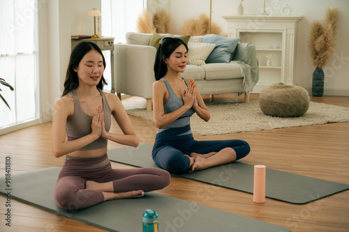 Wallpaper Mural Asian girl doing yoga at home with her friends.concept health care and activity. Torontodigital.ca