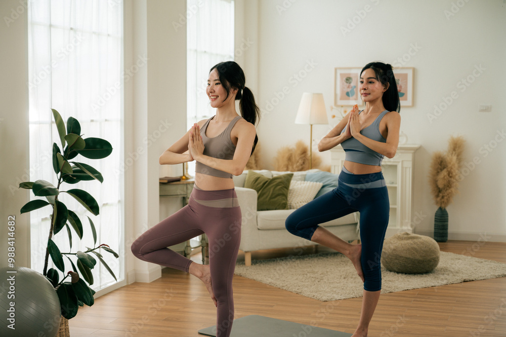 Obraz premium Asian woman yoga routine at Yoga studio