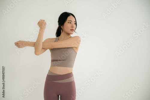 Asian woman yoga routine at Yoga studio