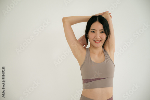 Asian woman yoga routine at Yoga studio