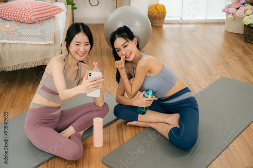 Asian girl doing yoga at home with her friends.concept health care and activity.