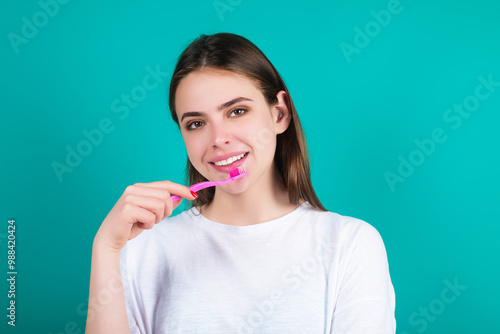 Young woman with teeth brush and toothpaste. Studio female portrait for dentistry. Dental toothpaste concept. Dental care. Mouth and teeth. Young girl teeth brushing with toothpaste. Whitening