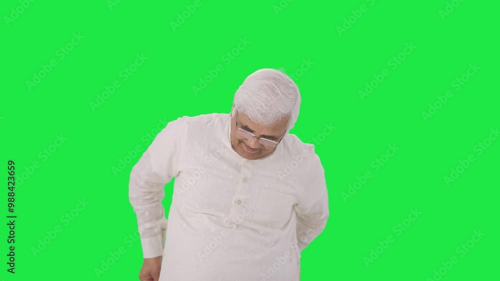 Happy Indian old man measuring waist using inch tape Green screen Happy Indian old man measuring waist using inch tape Green screen