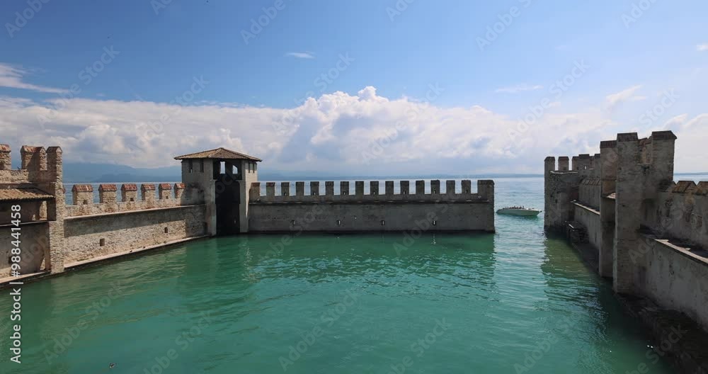 The walls of the Scaligero Castle on Lake Garda in historical centre of Sirmione, Italy, Europe. The walls of the Scaligero Castle on Lake Garda in historical centre of Sirmione, Italy, Europe.