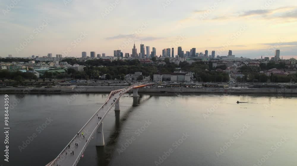Smooth panning aerial movement above the new Kladka na Wisle bridge on sunset, Warsaw, Poland. Smooth panning aerial movement above the new Kladka na Wisle bridge on sunset, Warsaw, Poland.