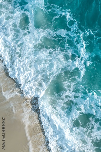 Aerial View of Ocean Waves Crashing on Sandy Beach