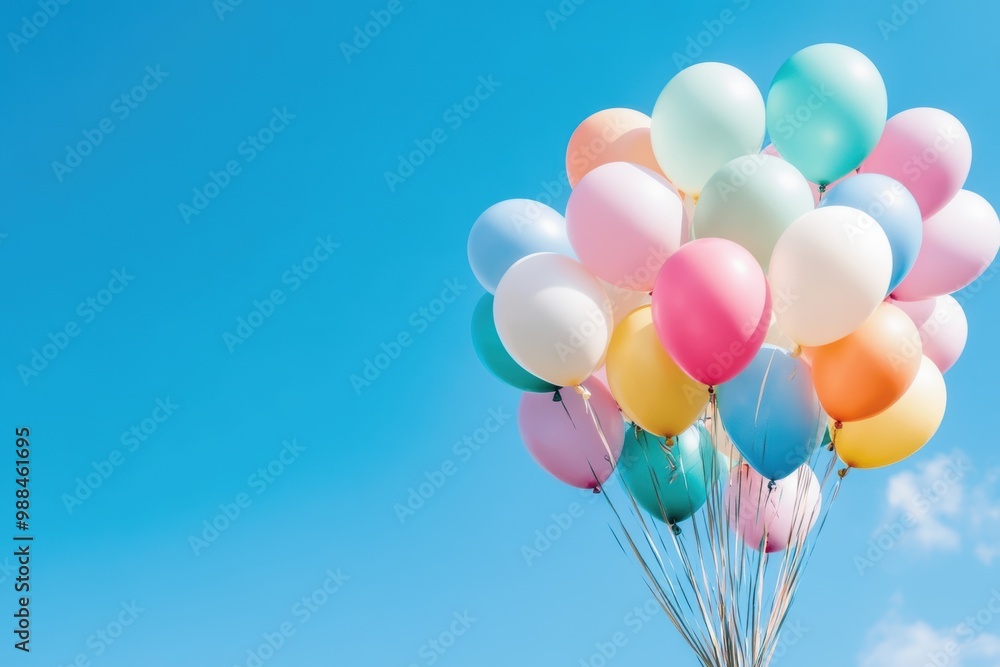 A vibrant cluster of colorful balloons floating against a clear blue sky, evoking feelings of joy and celebration. A vibrant cluster of colorful balloons floating against a clear blue sky, evoking feelings of joy and celebration.