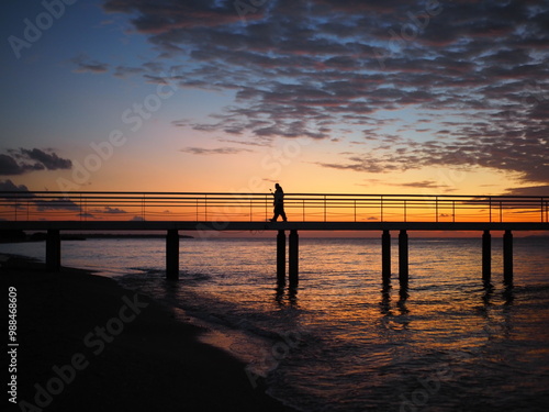 sunset, pier, sea, beach, ocean, sky, sun, beautiful, calm, horizon, red, blue, landscape, coast, bridge, water, purple, clouds, peopleshadow, shadow, impressive, scenary.