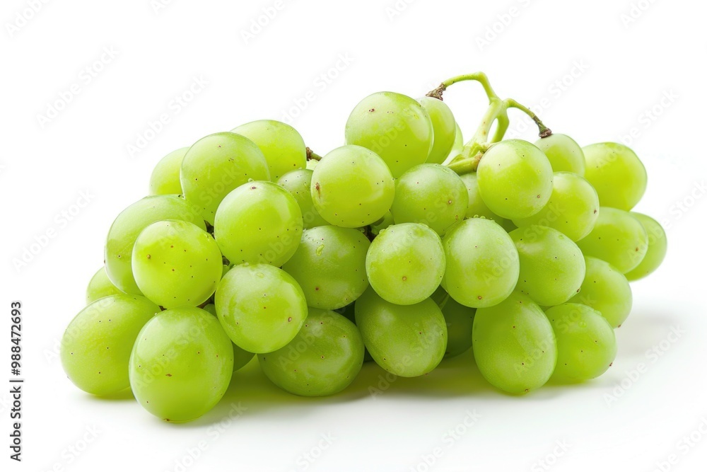 Fresh green grapes arranged on a clean white surface, great for food or still life photography Fresh green grapes arranged on a clean white surface, great for food or still life photography