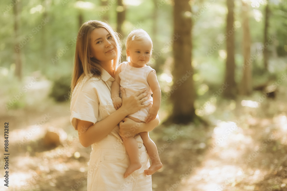 Young beautiful mother plays with her child outdoor. Young beautiful mother plays with her child outdoor.