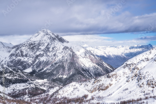Wallpaper Mural Panorama with a view on a beautiful mountain range with snowcapped mountain peaks, valley and forest, Montgenevre ski village, Alps, France Torontodigital.ca