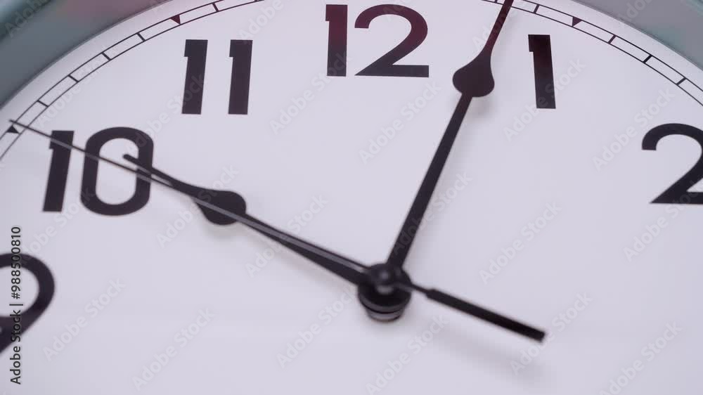 Time lapse Close-up Top view white wall clock with black numbers tells the time 9:50 a.m. Time lapse Close-up Top view white wall clock with black numbers tells the time 9:50 a.m.