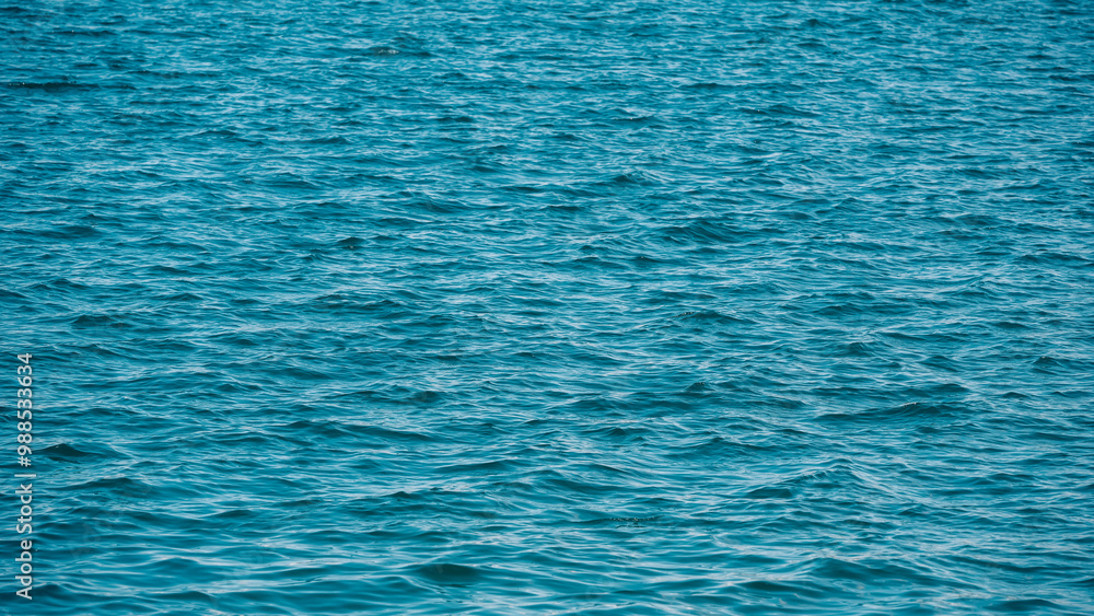 Fototapeta premium pattern of blue sea water with small waves