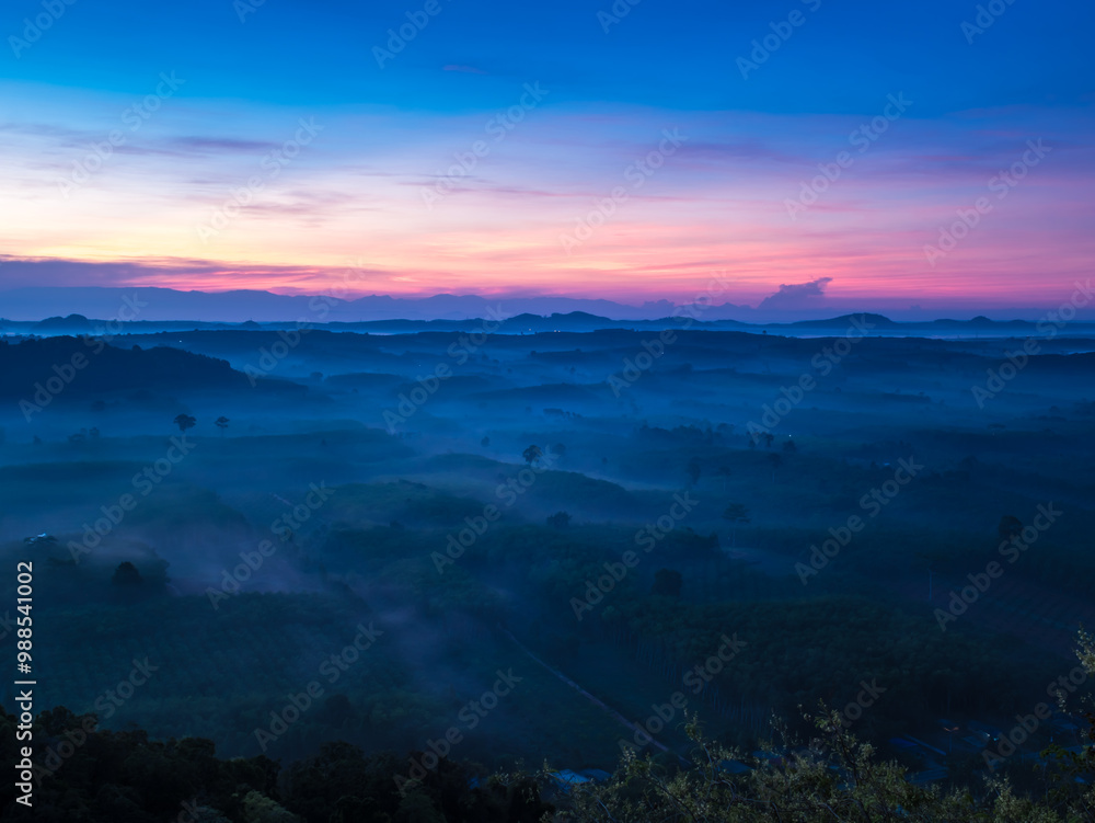 Fototapeta premium Landscape of beautiful morning fog sunrise at Khao Na Nai Luang Dharma Park in Surat Thani province, Thailand