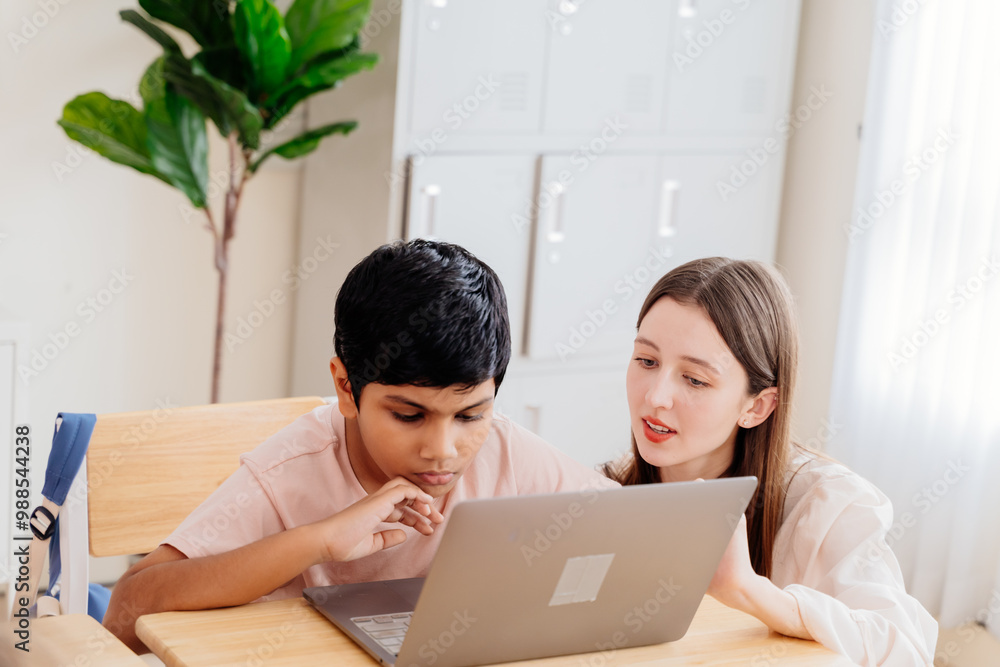 One-on-One Tech Instruction: Elementary School Setting Showcases Personalized Learning as Teacher Mentors Student in Essential Computer Skills One-on-One Tech Instruction: Elementary School Setting Showcases Personalized Learning as Teacher Mentors Student in Essential Computer Skills