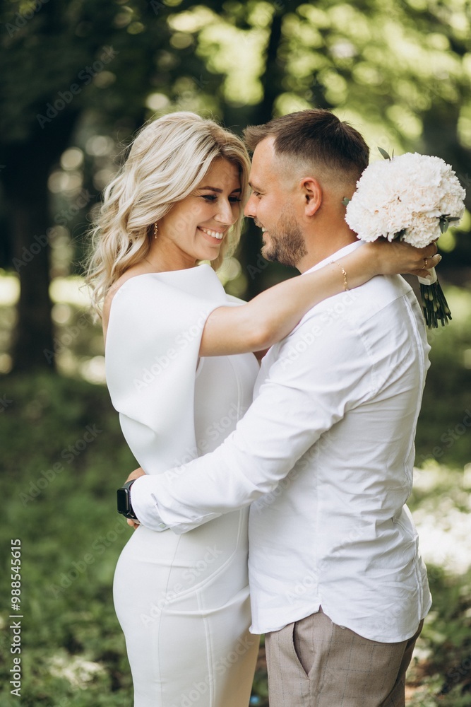 Joyful Couple Embracing in a Lush Green Park on a Bright Sunny Day Joyful Couple Embracing in a Lush Green Park on a Bright Sunny Day