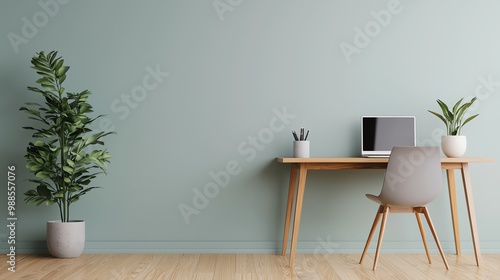 Modern workspace with minimalist design, featuring a wooden desk, computer, and potted plants on a soothing green wall. photo