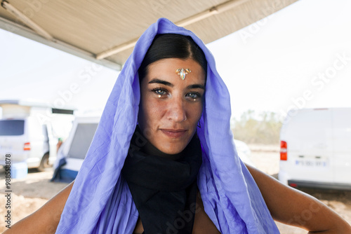 Woman in blue shawl at Monegros desert music festival photo