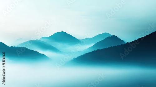 Serene mountain landscape shrouded in mist, showcasing layered peaks and a tranquil atmosphere, perfect for conveying peace and natural beauty. photo